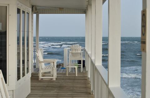 Wrap around porch on the ocean beach house.